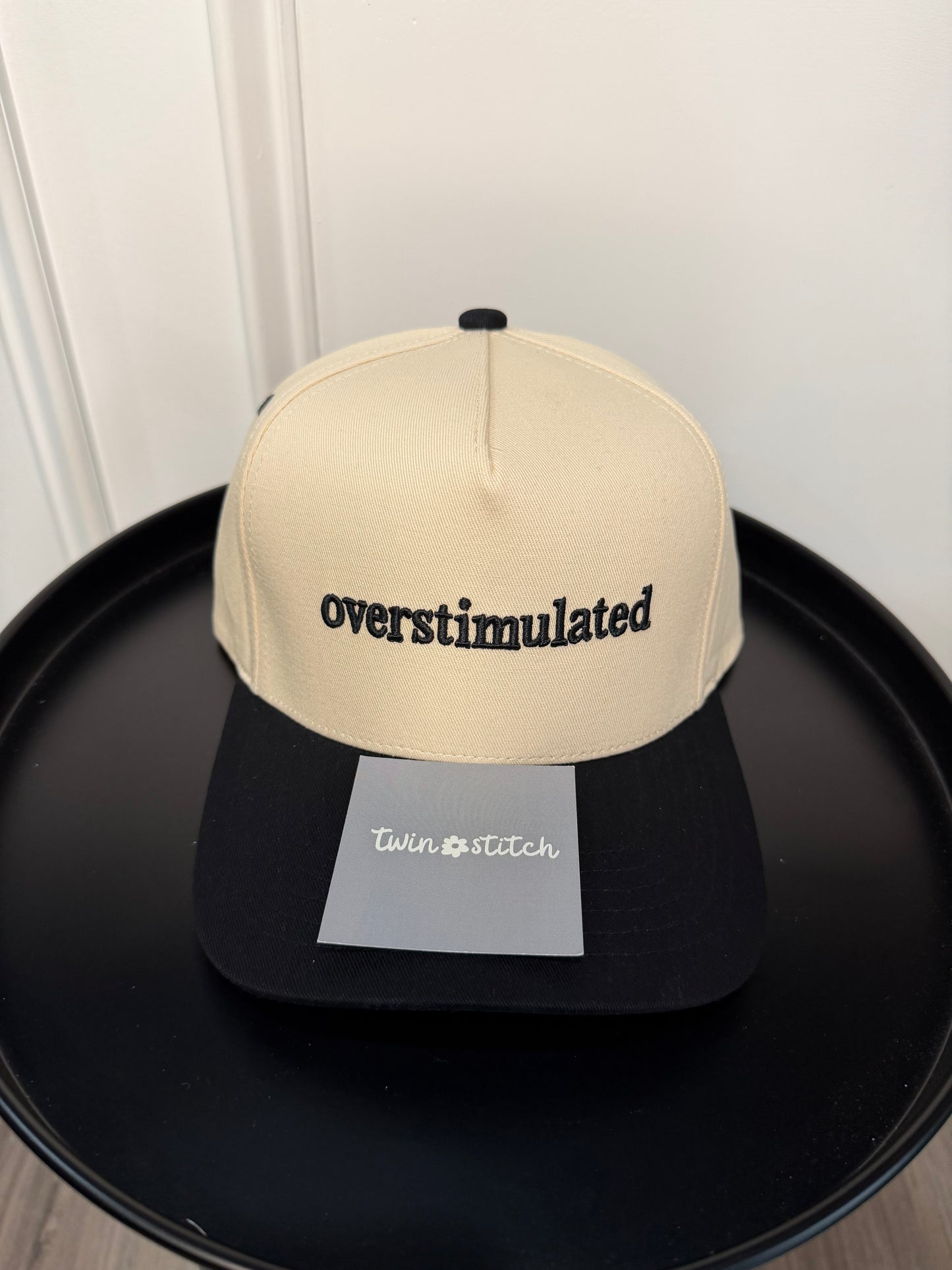 OVERSTIMULATED Letter Embroidered Two Tone Trucker Cap